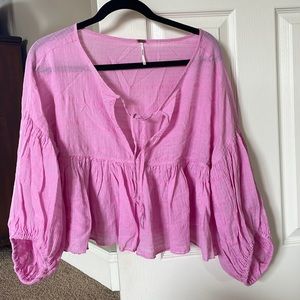 Free People blouse with ties in front. Wide puffy sleeves.